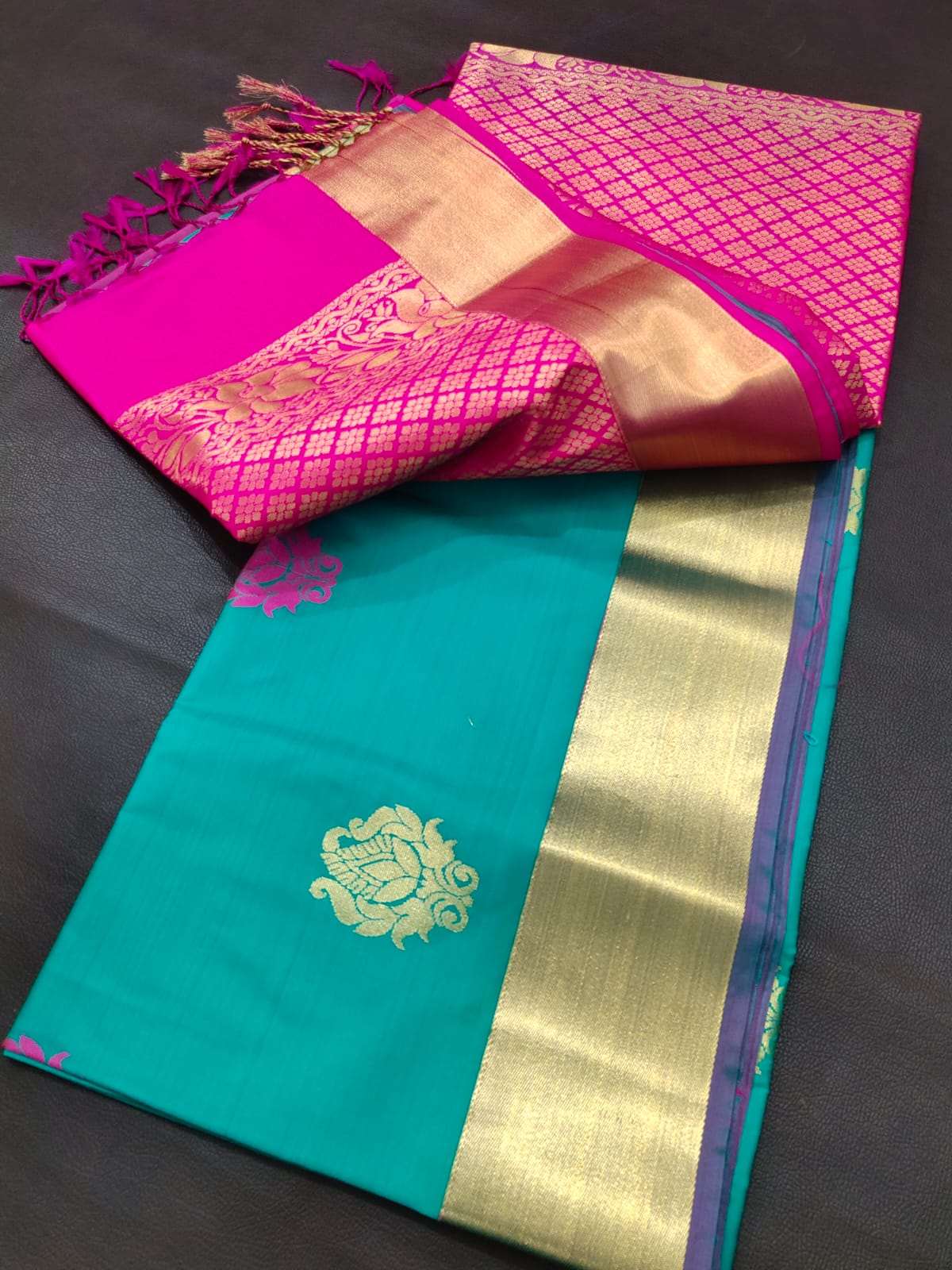 Green embossed silk saree, contrast border of mayil,yaanai,yaali & puli  nagam & zari rich pallu of intricate design